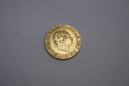 A GEORGE III GOLD SOVEREIGN DATED 1820