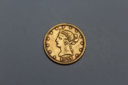 AN AMERICAN 1897 GOLD TEN DOLLAR COIN