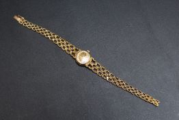 A LADIES OMEGA WRIST WATCH, on graduating yellow metal strap stamped 750, movement casing also