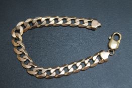 A HALLMARKED 9 CARAT GOLD CURB LINK BRACELET, clasp is a later replacement, approx weight 28.4g, L
