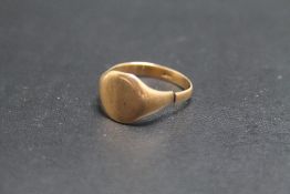 A GENTS 9CT GOLD SIGNET RING, band warped and split, approx weight 2.9g