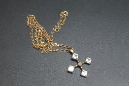 A HALLMARKED 9 CARAT GOLD PENDANT, set with aquamarine style stones and a central seed pearl all