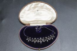 A DIAMOND AND SEED PEARL ANTIQUE NECKLACE, in fitted case.