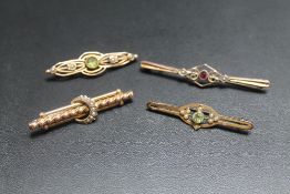 TWO 9CT PIN BROOCHES, together with two other pin badges (4)
