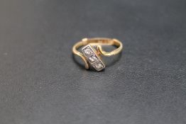 A 9CT GOLD THREE STONE DIAMOND RING, fitted with a size adjustment, approx weight 2.3g, current ring