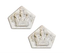 A PAIR OF PLASTER PLAQUES