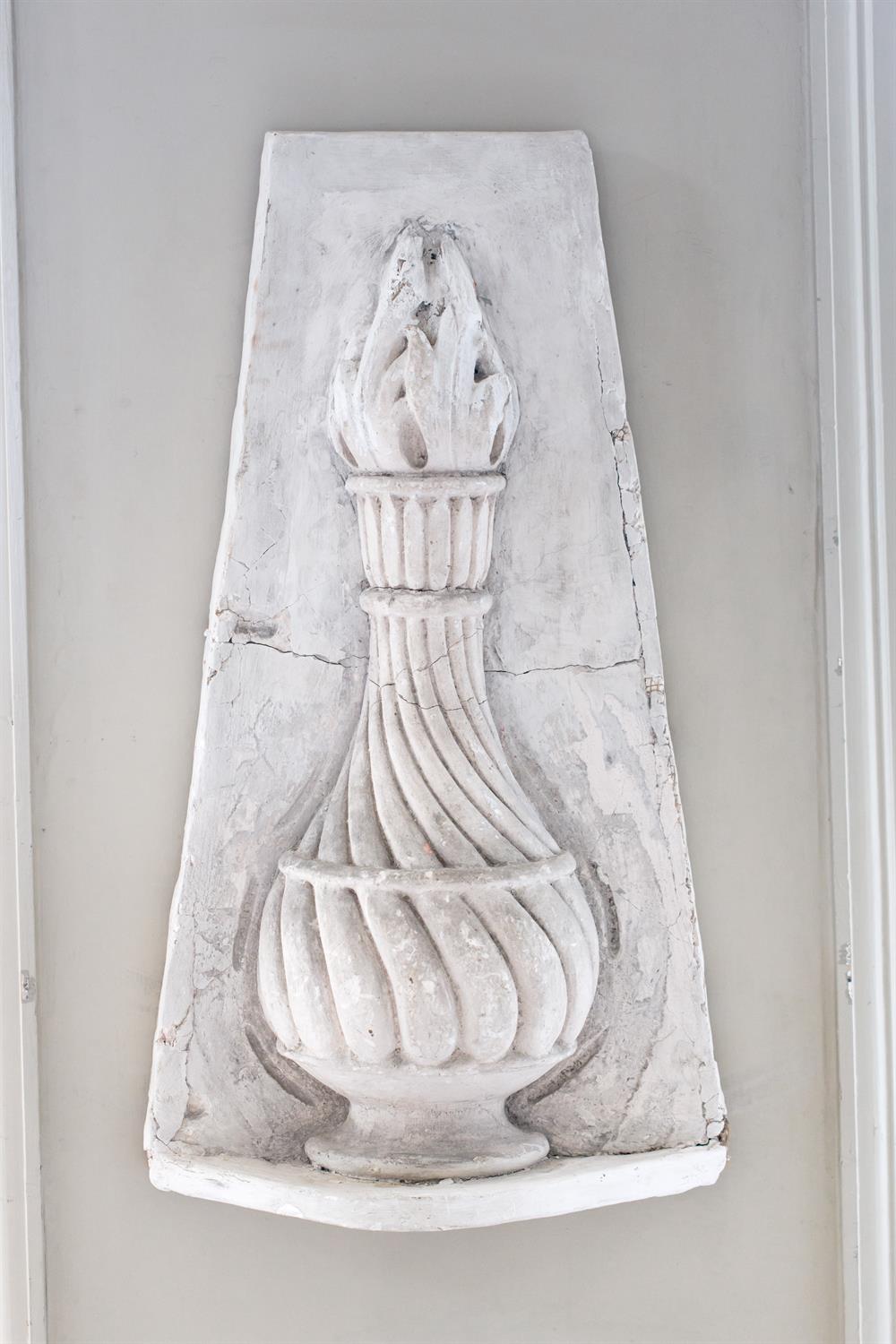 A PLASTER PANEL OF A FLAMING TORCHLATE 19TH/EARLY 20TH CENTURY