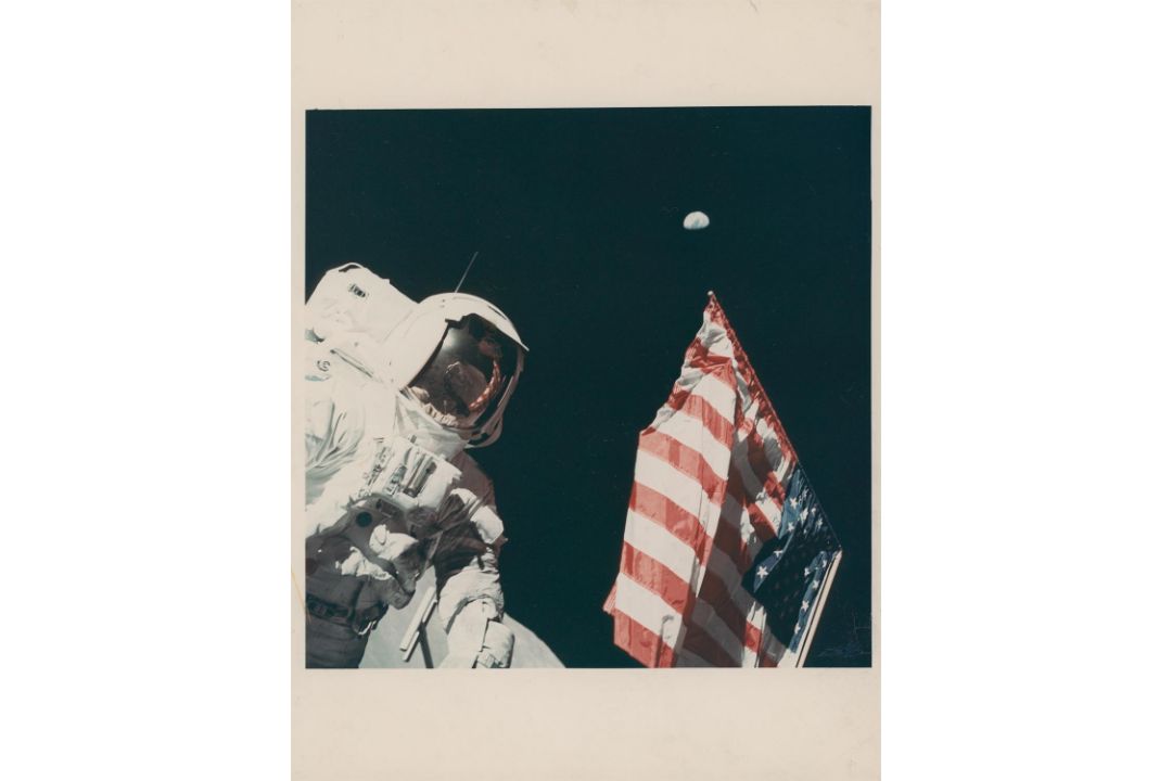 Harrison Schmitt with the Earth above the American flag, Apollo 17, December 1972, EVA 1 - Image 1 of 2