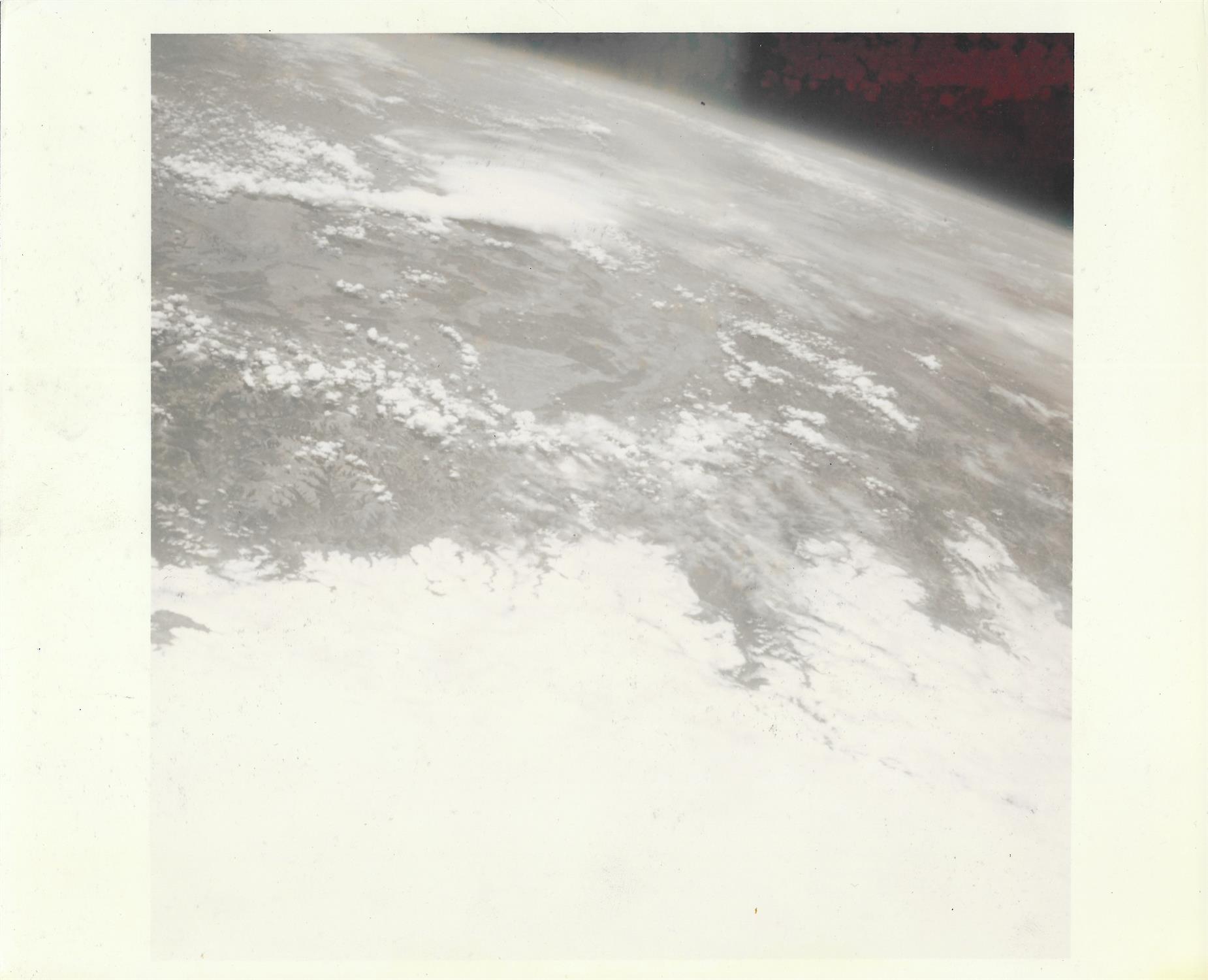 An Earth view taken during the last solo flight, Mercury Atlas 9, May 1963