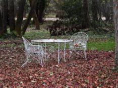 A suite of Victorian white painted wirework garden furniture