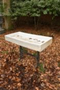 A glazed stoneware and cast iron garden sink or trough