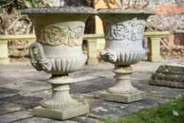 A pair of stone composition campana urns
