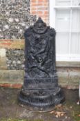 A painted cast iron wall fountain to a model by Val d'Osne
