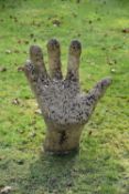 An unusual garden sculpture or seat in the form of a hand