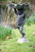 A lead figural bird bath