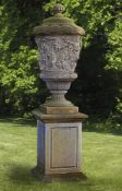 A sculpted limestone garden urn-and-cover