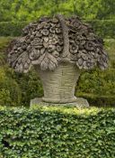 A large Continental sculpted limestone pier ornament modelled as a basket of flowers