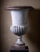 A large cast iron garden urn