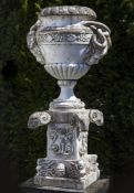 An Italian sculpted Carrara marble urn on pedestal