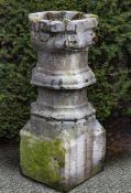 A carved limestone font