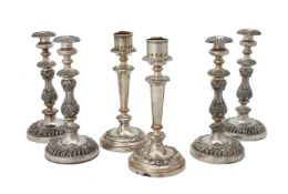 A set of four electro-plated candle sticks