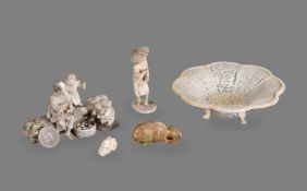 Y A Japanese Ivory Group of a man and boy seated on a large tree trunk
