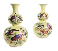 A pair of Dresden yellow ground double gourd vases painted with various birds