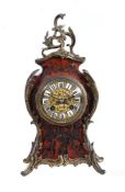 Y A tortoiseshell and gilt metal mounted mantel clock