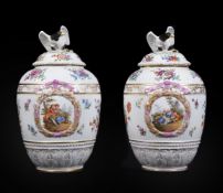 A pair of German porcelain Berlin style vases and covers with eagle finials