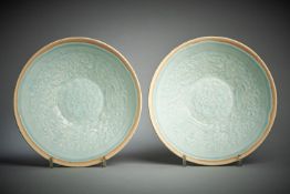 A pair of Chinese qingbai moulded bowls