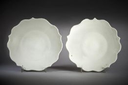 A fine pair of white-glazed five-petalled foliate dishes