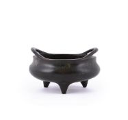A rare Chinese bronze two-handled tripod censer