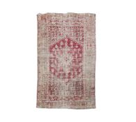 A WOVEN CARPET, PROBABLY TURKISH