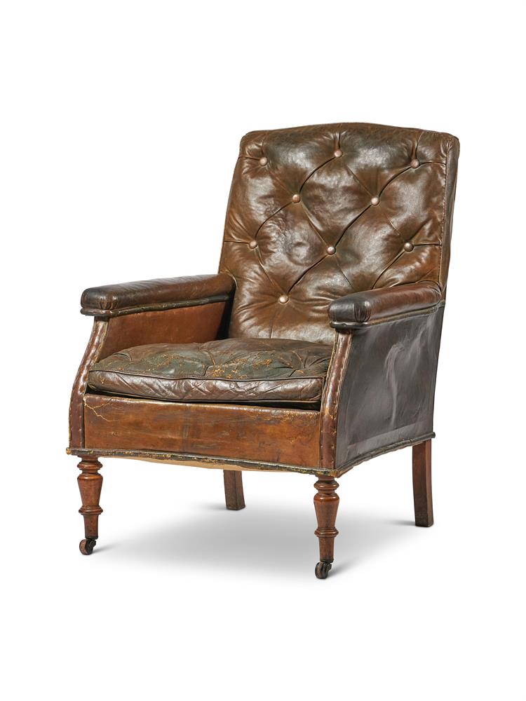 A WILLIAM IV MAHOGANY FRAMED AND BUTTON LEATHER UPHOLSTERED LIBRARY CHAIR