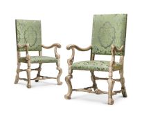 A PAIR OF CARVED WOOD, PAINTED AND SILVERED ARMCHAIRS