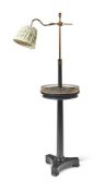 AN EBONISED STANDARD LAMP
