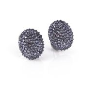 A pair of colour change garnet ear clips by Hemmerle