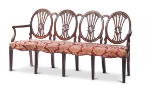 A GEORGE III CARVED PADOUK CHAIR-BACK SETTEE
