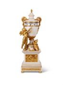 A FRENCH ORMOLU MOUNTED WHITE MARBLE MANTEL CLOCK