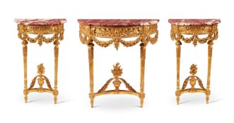 A SUITE OF THREE FRENCH GILTWOOD CONSOLE TABLES