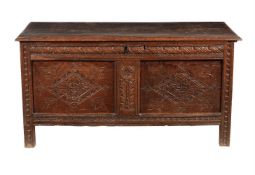 A carved oak coffer