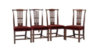 A set of four George III mahogany dining chairs