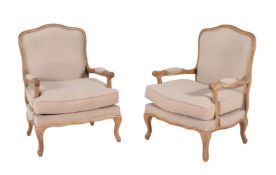 A pair of oak and upholstered armchairs in Louis XV style