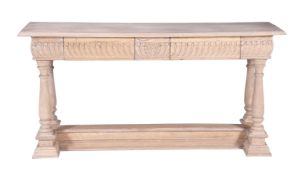 A limed hardwood console table in Continental 18th century style