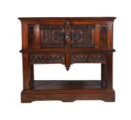 A carved oak hall cupboard