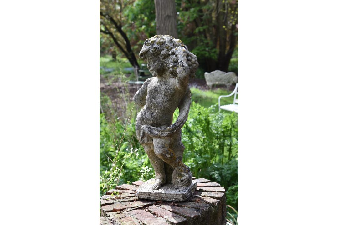 A carved limestone model of a Bacchic putto - Image 1 of 2