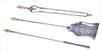 A set of Victorian brass and steel fire irons