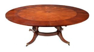 A MAHOGANY CONCENTRIC EXTENDING CIRCULAR DINING TABLE, IN GEORGE III STYLE