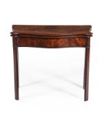 AN EARLY GEORGE III MAHOGANY SERPENTINE FOLDING CARD TABLE, IN THE MANNER OF THOMAS CHIPPENDALE