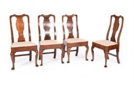 A CLOSELY MATCHED SET OF EIGHT GEORGE II 'RED WALNUT' DINING CHAIRS, CIRCA 1750